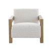 The Abbey Accent Chair, with its solid oak frame and plush cream boucle upholstery, offers both comfort and elegance, making it the perfect addition to any living room.