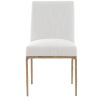 The Sloane Dining Chair, with its brass gold metal legs and off-white C0 fabric upholstery, effortlessly adds a chic mid-century modern touch to any dining space.