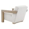The Abbey Accent Chair, with its solid oak frame and plush cream boucle upholstery, offers both comfort and elegance, making it the perfect addition to any living room.