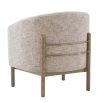 The Banbury Accent Chair, with its curved upholstered back, brass detailing, and natural linen fabric, adds refined elegance to any interior.