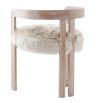 The Baaarb Dining Chair, with its real cream sheepskin seat and solid oak frame, exudes luxurious contemporary style and texture, making it a striking addition to any dining space.