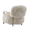 The Baaarb Accent Chair, featuring real cream sheepskin and a solid oak frame, adds Scandi-inspired charm and luxury to any room.