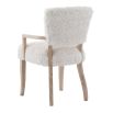 The Winnie Dining Armchair, with its faux sheepskin upholstery and solid oak frame, adds Alpine elegance and comfort, featuring solid oak arms for added support.