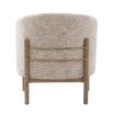 The Banbury Accent Chair, with its curved upholstered back, brass detailing, and natural linen fabric, adds refined elegance to any interior.
