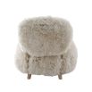 The Baaarb Accent Chair, featuring real cream sheepskin and a solid oak frame, adds Scandi-inspired charm and luxury to any room.