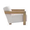 The Abbey Accent Chair, with its solid oak frame and plush cream boucle upholstery, offers both comfort and elegance, making it the perfect addition to any living room.