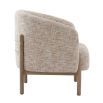 The Banbury Accent Chair, with its curved upholstered back, brass detailing, and natural linen fabric, adds refined elegance to any interior.