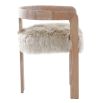 The Baaarb Dining Chair, with its real cream sheepskin seat and solid oak frame, exudes luxurious contemporary style and texture, making it a striking addition to any dining space.