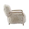 The Baaarb Accent Chair, featuring real cream sheepskin and a solid oak frame, adds Scandi-inspired charm and luxury to any room.