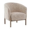 The Banbury Accent Chair, with its curved upholstered back, brass detailing, and natural linen fabric, adds refined elegance to any interior.