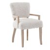The Winnie Dining Armchair, with its faux sheepskin upholstery and solid oak frame, adds Alpine elegance and comfort, featuring solid oak arms for added support.