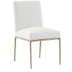 The Sloane Dining Chair, with its brass gold metal legs and off-white C0 fabric upholstery, effortlessly adds a chic mid-century modern touch to any dining space.