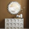 Circular mirror with exquisite white frame resembling sun beams.
