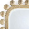 Natural-coloured wall mirror with wooden spheres on border