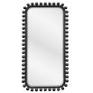 Tall black wooden dressing mirror with ball details along the frame