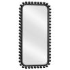 Tall black wooden dressing mirror with ball details along the frame