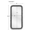 Tall black wooden dressing mirror with ball details along the frame