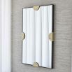 Rectangular wall mirror with black border and brass semi-circle clips 
