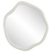 A organically shaped mirror with a stunning stone finish