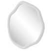 A organically shaped mirror with a stunning stone finish