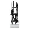 Visually intriguing black sculpture on white marble base