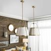 White ceiling light with brass frame details