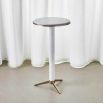 Glamorous, slender side table crafted from white marble with brass accents