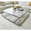 Sleek coffee table with eye-catching marble base and grey minimal frame with glass top