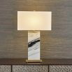 Black and white marble lamp with brass base and rectangular linen shade