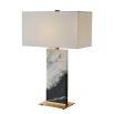 Black and white marble lamp with brass base and rectangular linen shade