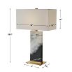 Black and white marble lamp with brass base and rectangular linen shade