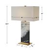 Black and white marble lamp with brass base and rectangular linen shade