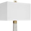 A luxury side lamp by Uttermost with a sophisticated white marble and brushed brass finish