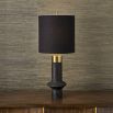 Cast black stone lamp with brass pillbox cap and cylindrical finial