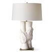 A stylish side lamp by Uttermost with a white ceramic sculptural base and white textured cotton shade