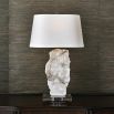 Organic cut of translucent alabaster adorns the lamp base with a tapered oval shade