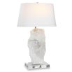Organic cut of translucent alabaster adorns the lamp base with a tapered oval shade