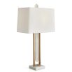 Rich brass table lamp with floating crystal quartz between metal frame