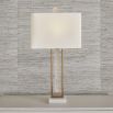 Rich brass table lamp with floating crystal quartz between metal frame