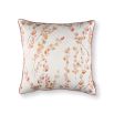 A beautiful, blush-coloured cushion with a floral design