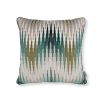 A velvet and linen cushion with a dark green and copper chevron pattern.