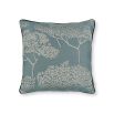 A light pastel cushion with cream coloured tree motifs