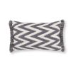 A grey, zig zag patterned outdoor cushion with fringe details.