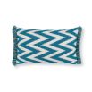 A teal, zigzag patterned cushion with matching fringe details.