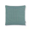 A teal houndstooth inspired outdoor cushion