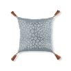 Grey cushion with white flowers and green leaves, brown tassels and leopard print reverse 