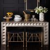 A stunning hand-stamped nickel waterfall console table