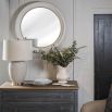 Charming round mirror with thick white frame