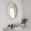 Charming round mirror with thick white frame