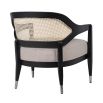 Enchanting armchair with black frame, rattan backrest and sumptuous linen seat